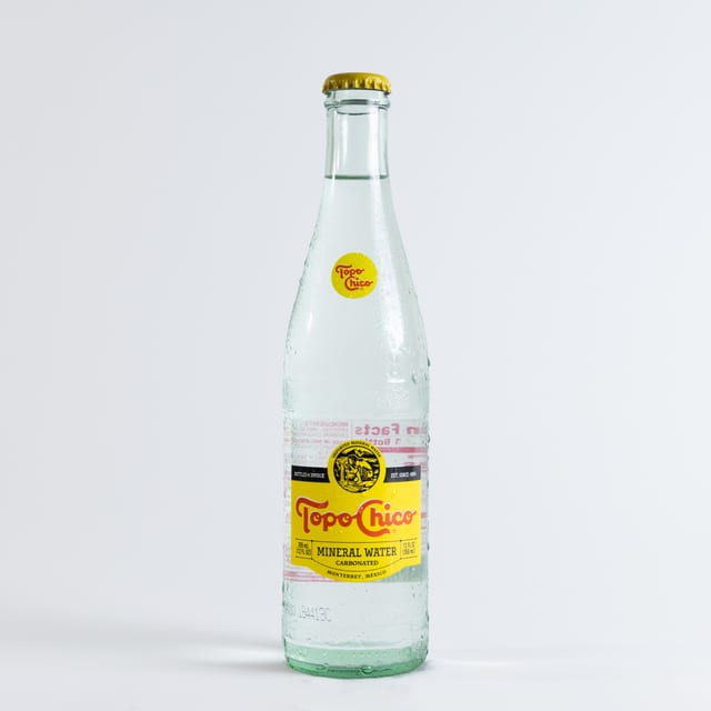 Topo Chico Sparkling Mineral Water Glass Bottle.